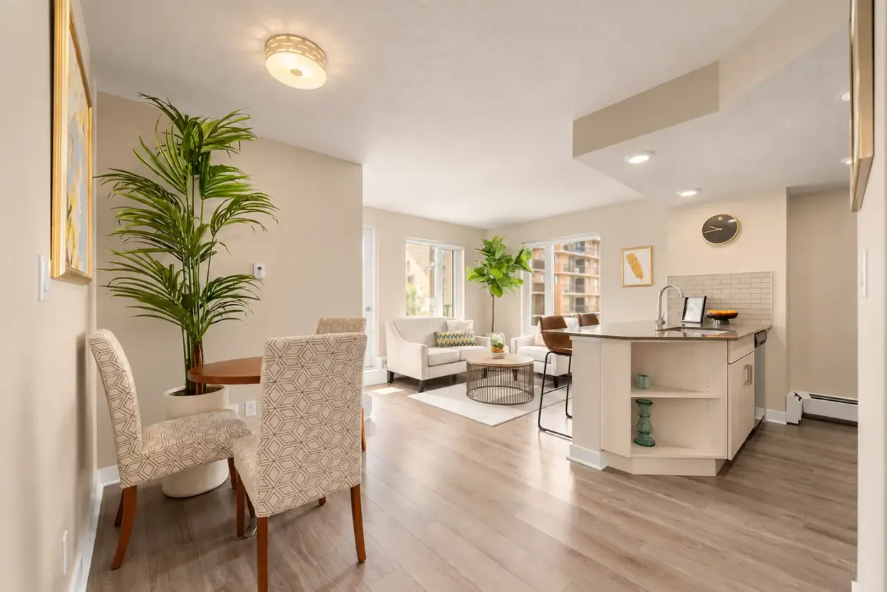 A furnished Metropole suite with an open kitchen, dining area and living room