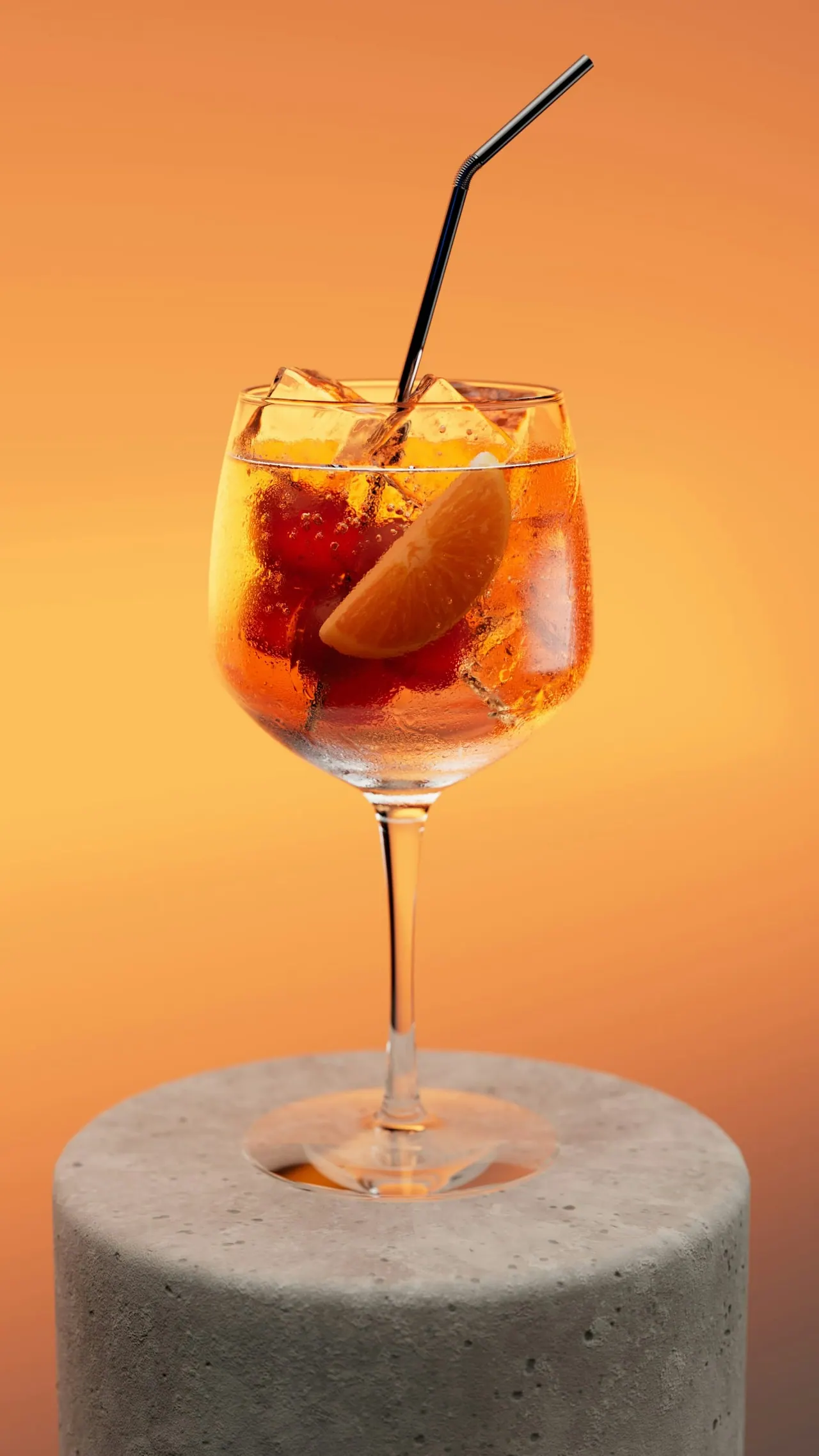 A fruit spritz on a stone plinth in amber light