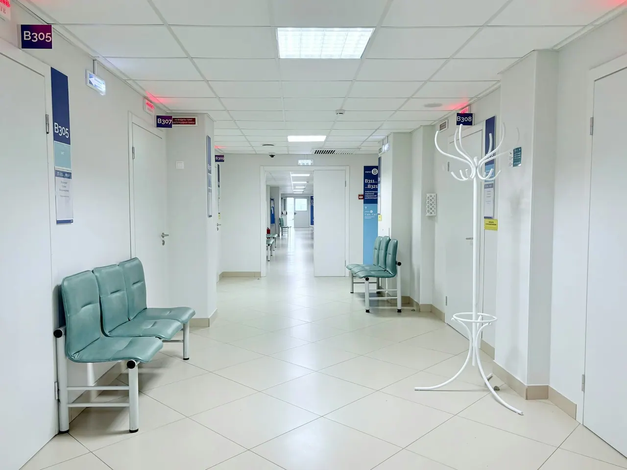A bright, quiet clinic corridor with seating