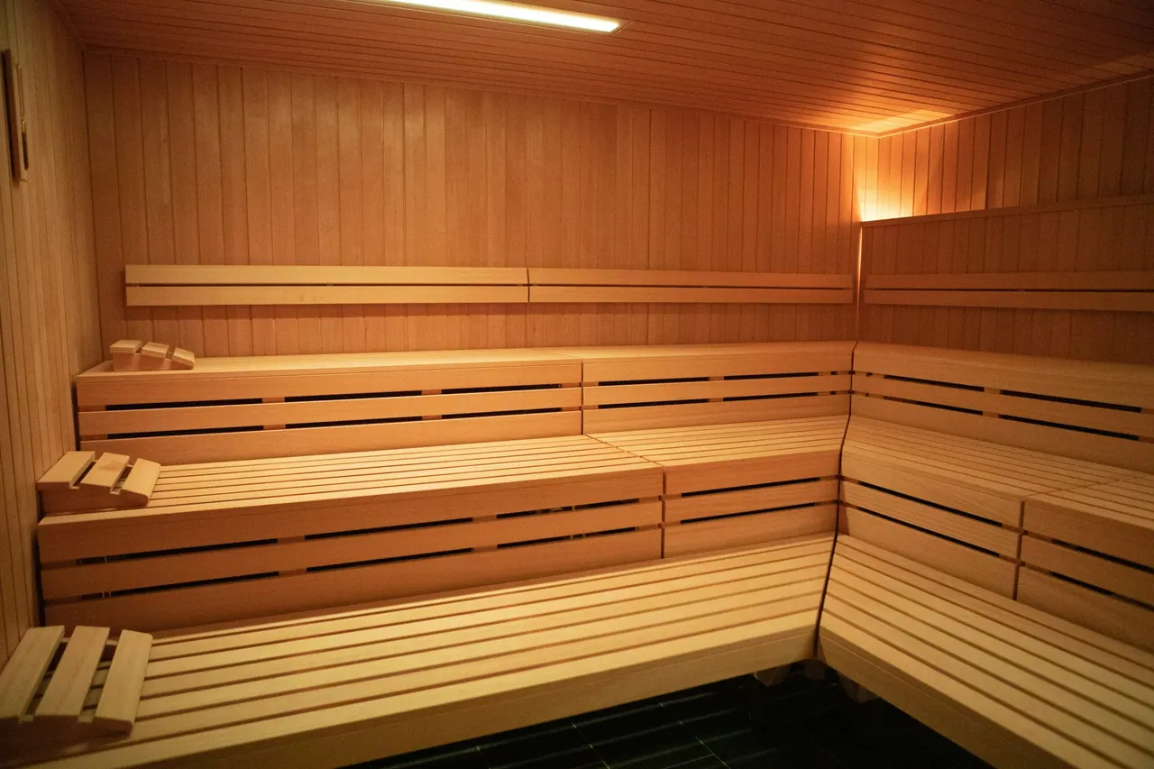 A light pine sauna with soft lighting