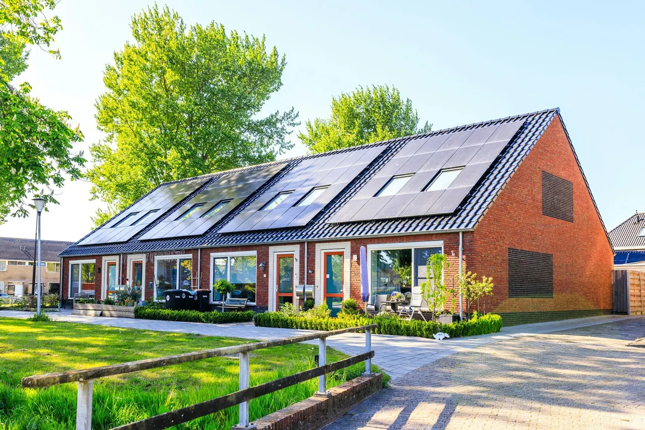A row of brick homes with solar panels on the roof