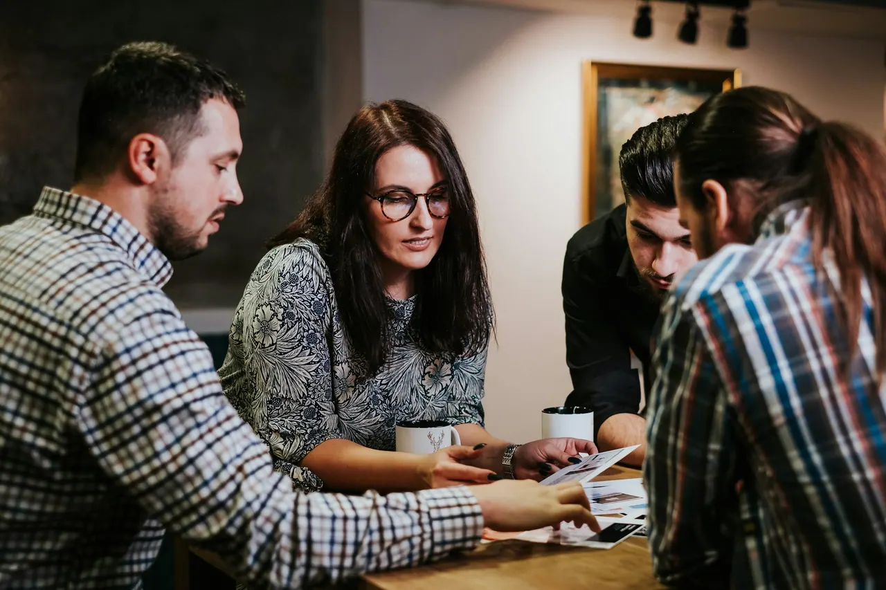 A family reviewing papers together at a wooden table