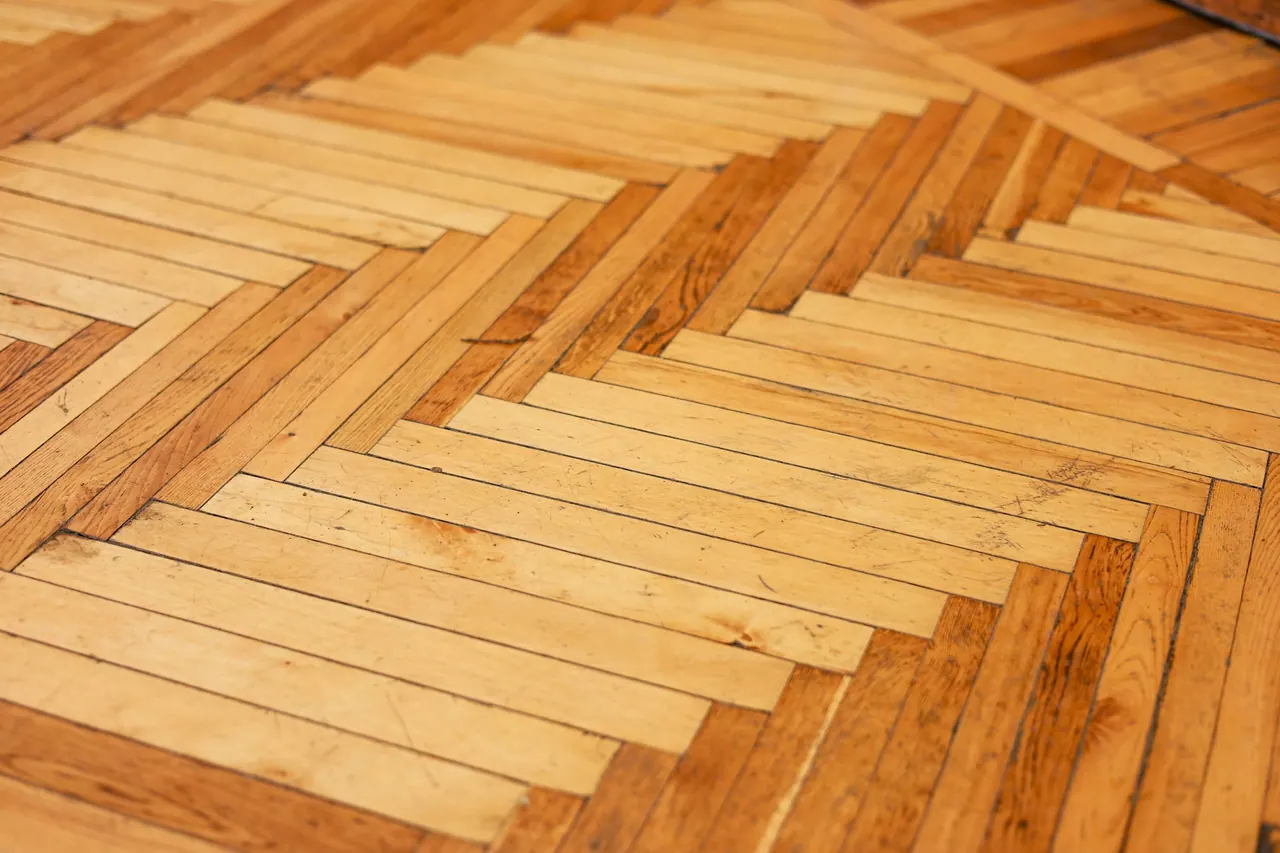 A warm oak parquet floor laid in herringbone