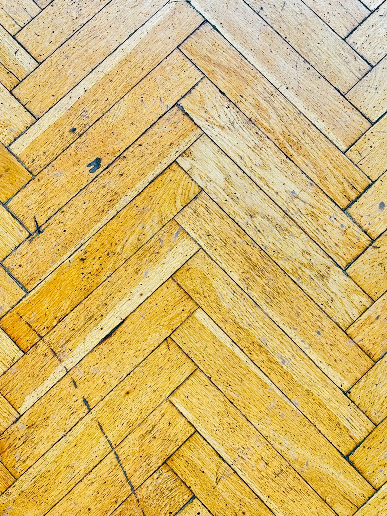 Golden oak parquet in a herringbone pattern