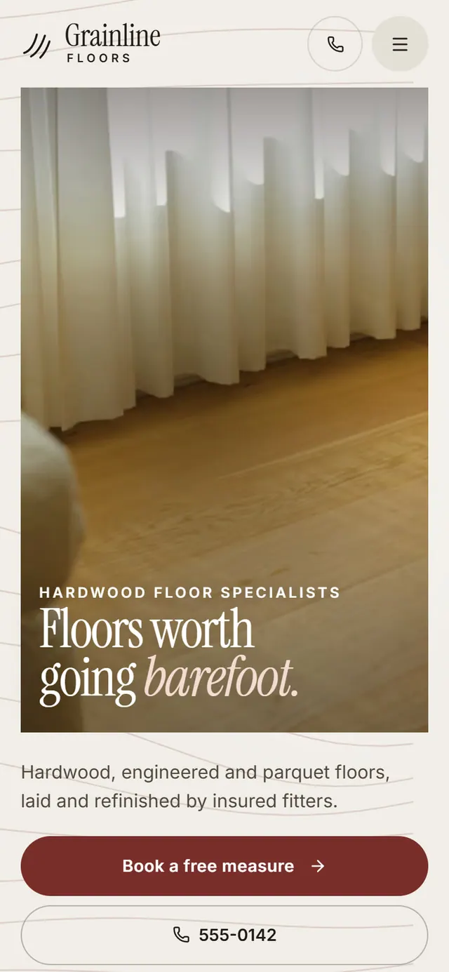Grainline Floors: the website on a phone
