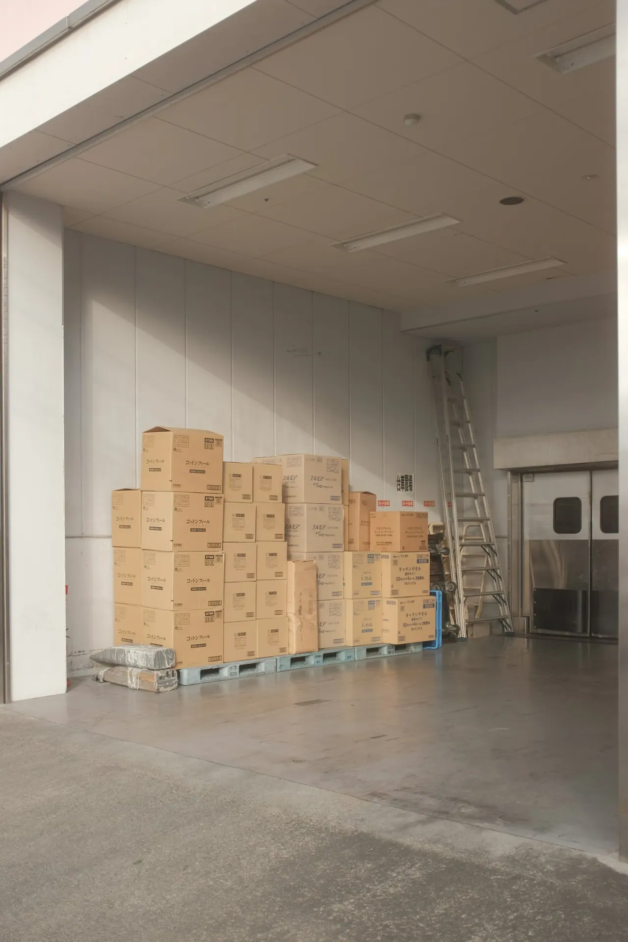 Moving boxes stacked neatly in an empty room
