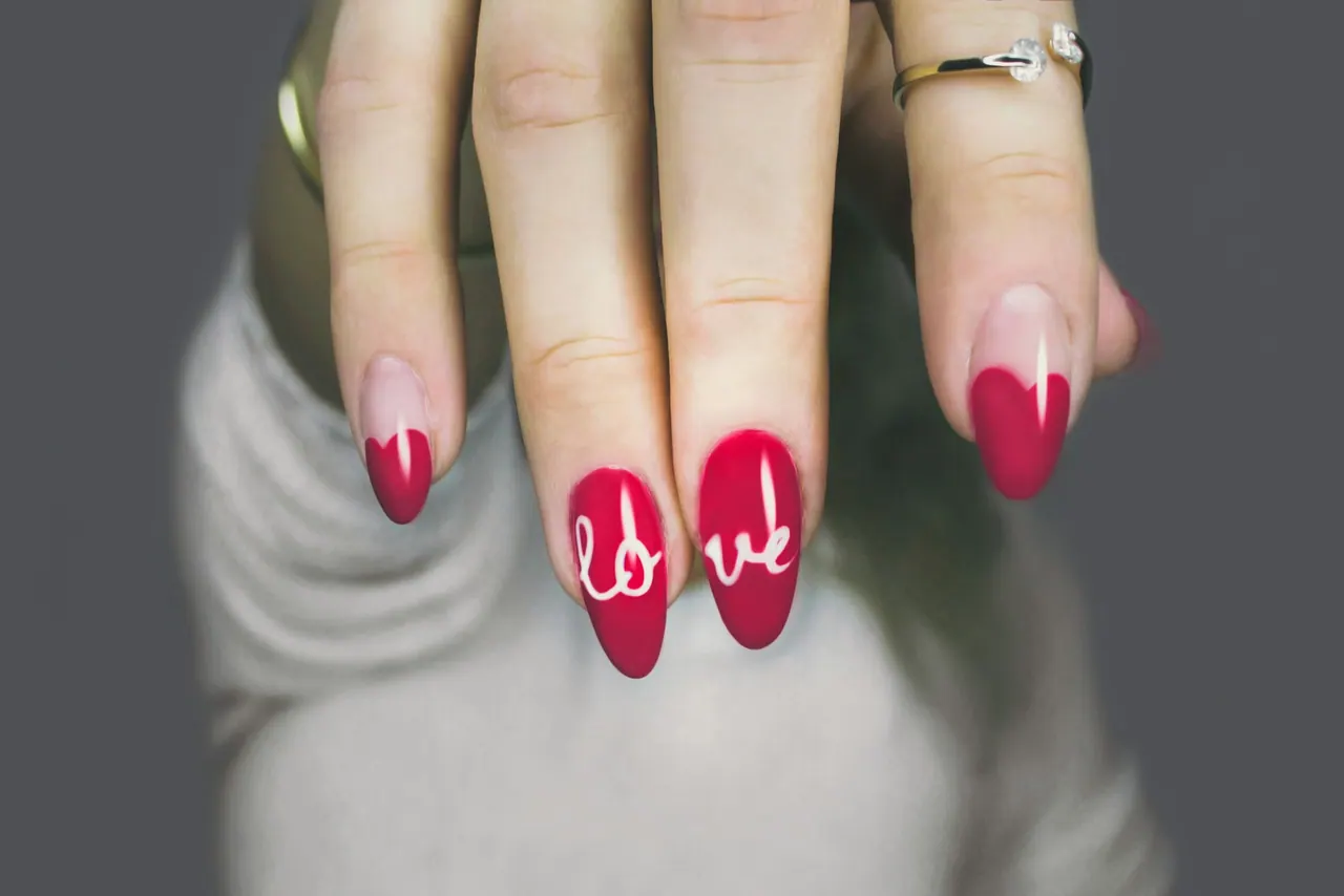 Red almond nails with hand painted lettering