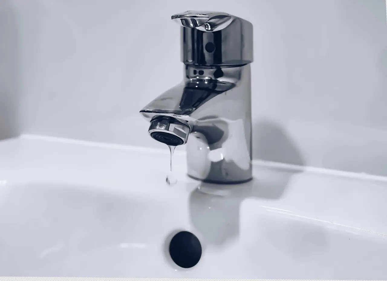 A polished chrome bathroom tap