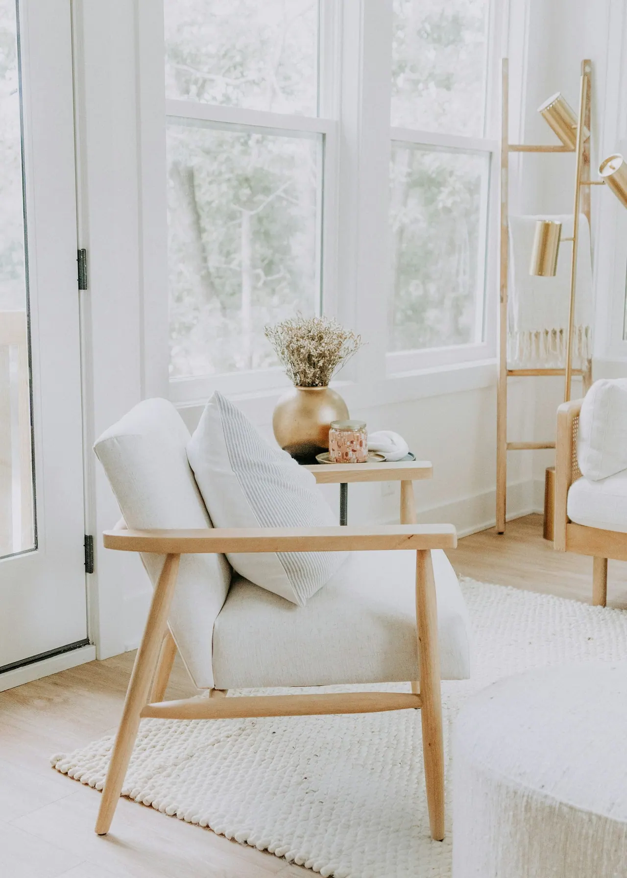 A bright corner of our counselling room with a cream armchair