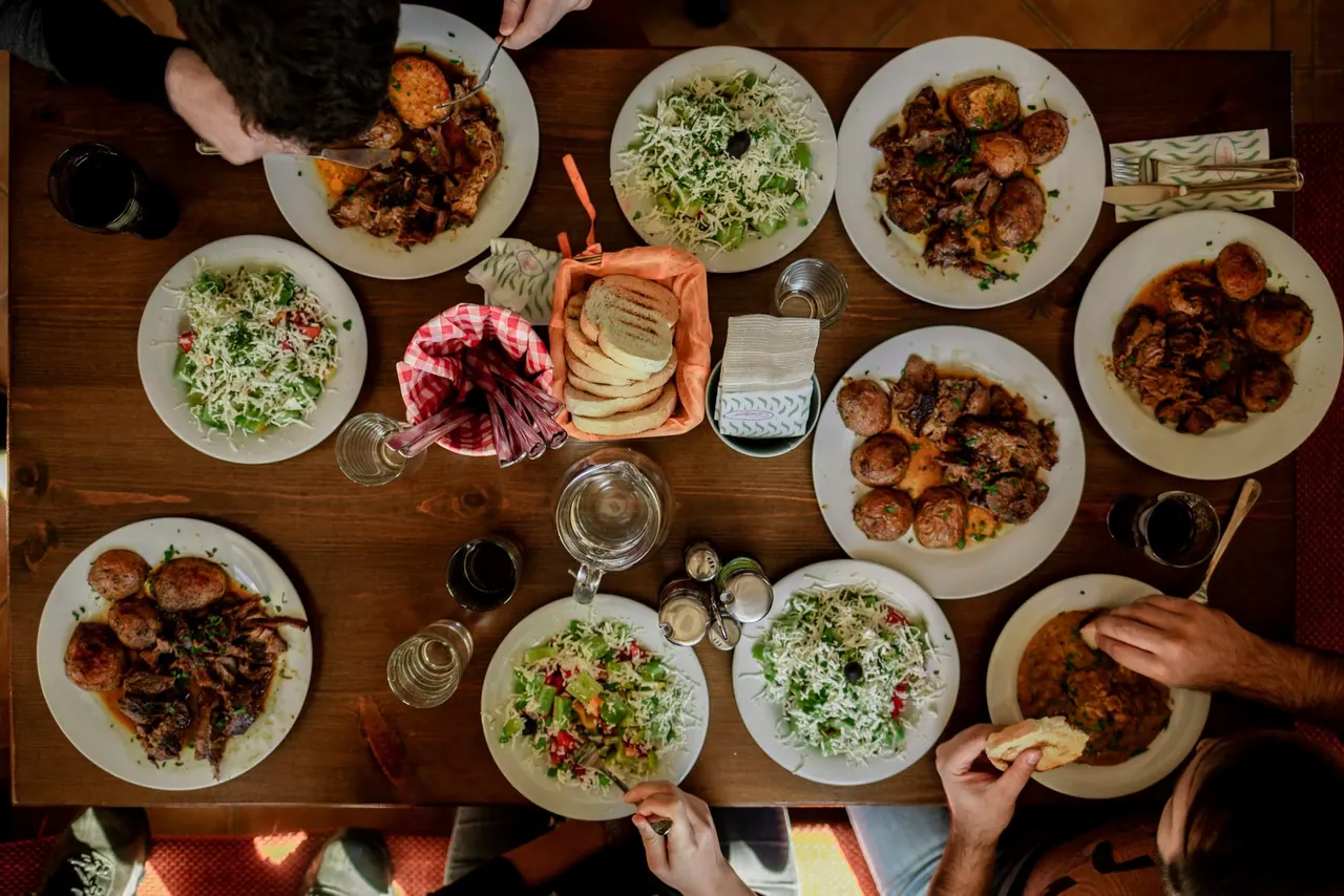 Shared plates laid out along a wooden table
