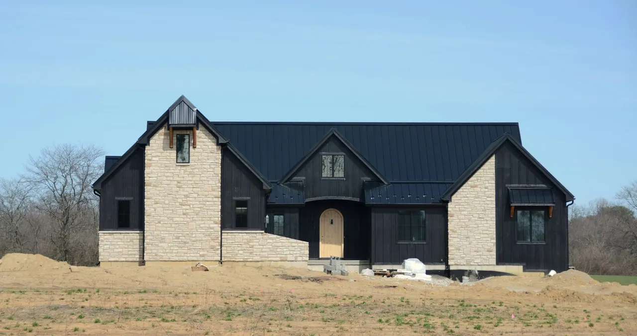 A new black and stone family home we built on an open plot
