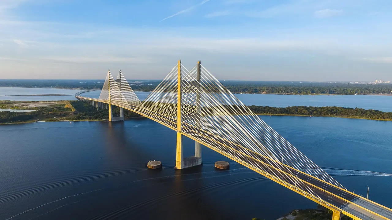 A cable-stayed bridge connecting two shores across open water.