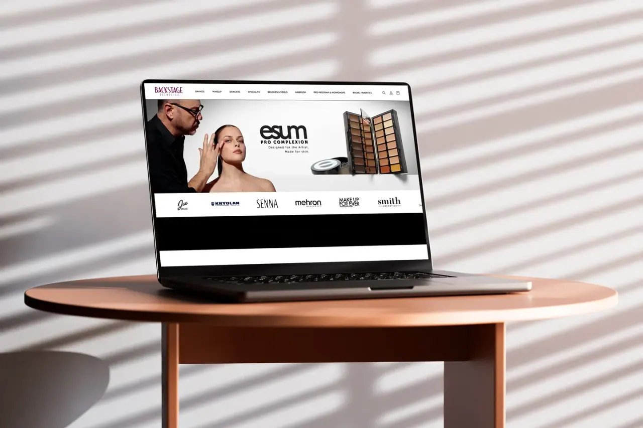 The Backstage Cosmetics online store shown on a laptop